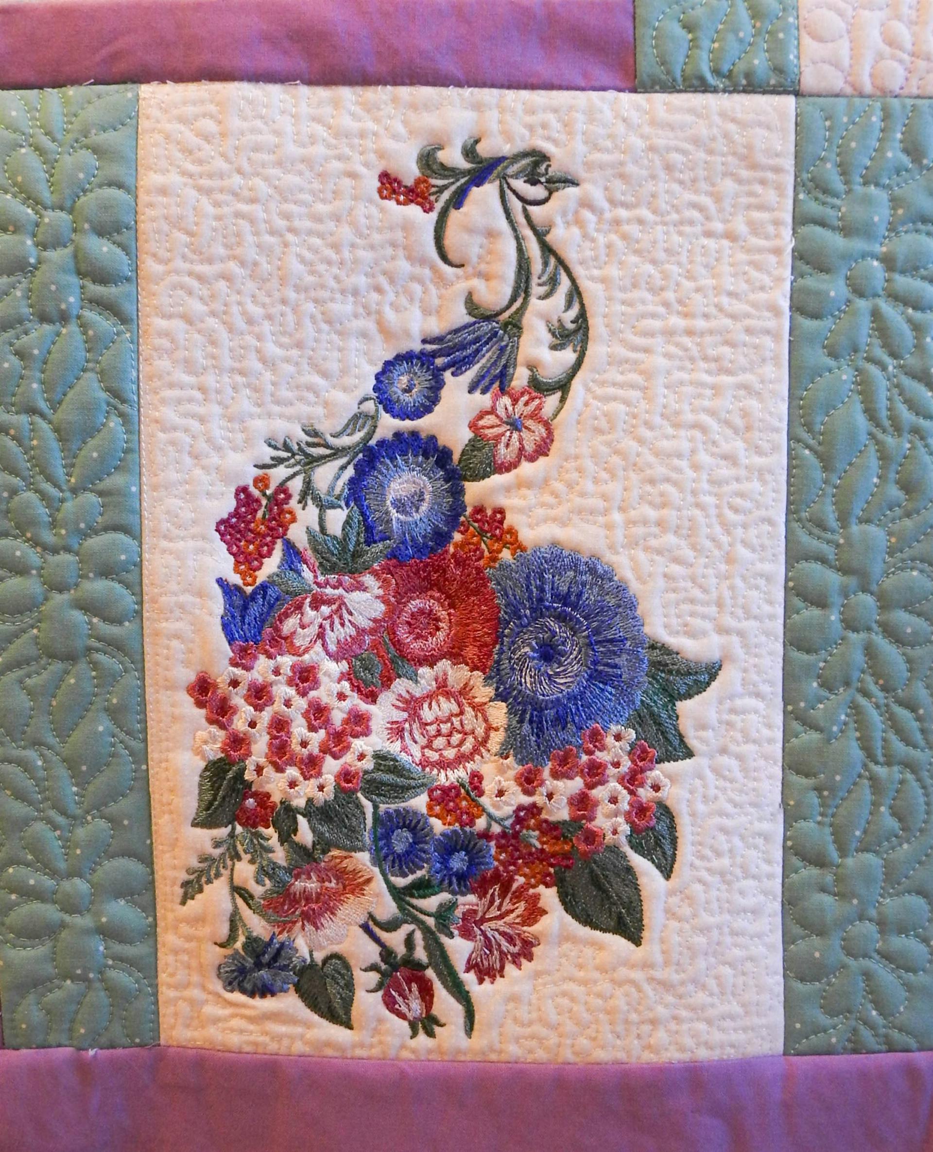Floral peacock with stippling added to quilt block