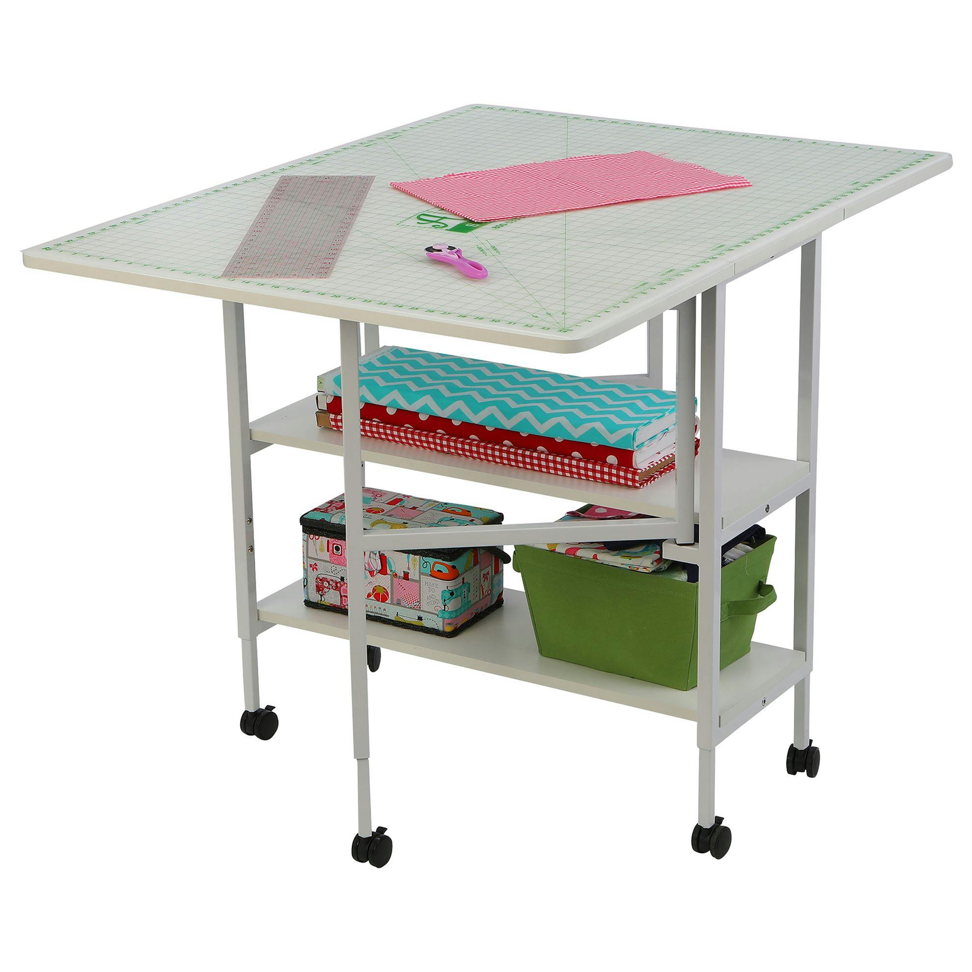 photo of Arrow Dixie Cutting Table with cutting mat an stored items