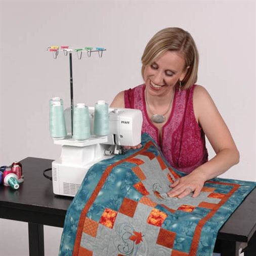 pfaff serger with woman working on quilt
