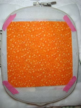 RNK Embroidery Perfection Tape holding fabric on back of hoop