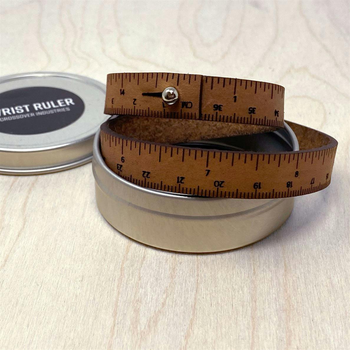 brown wrist ruler with tin package