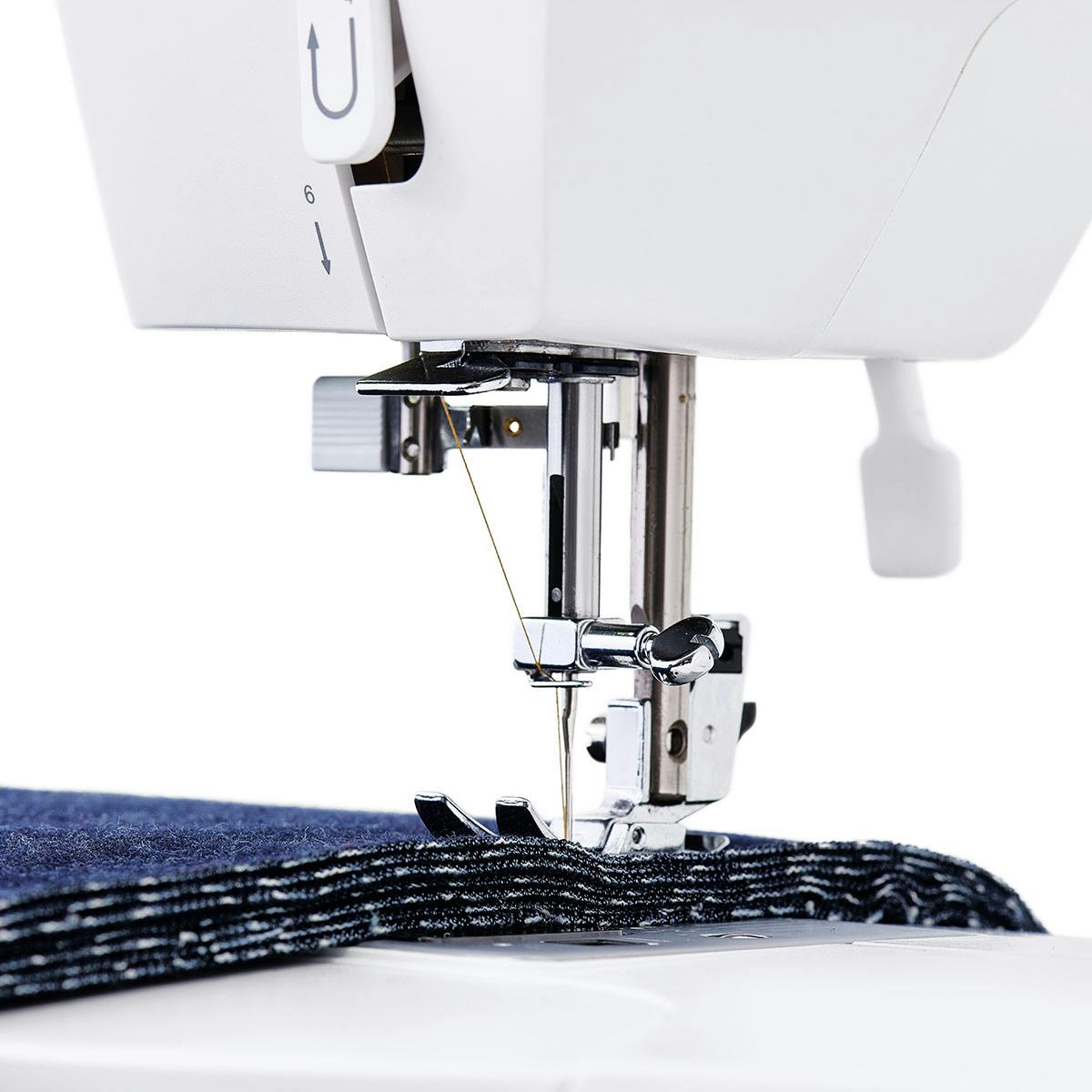 Singer Elite CE677 computerized sewing machine sewing layers of denim
